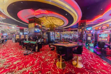 A close-up shot of golden coins falling around a spinning roulette wheel, representing immersive casino action at JILI7979.